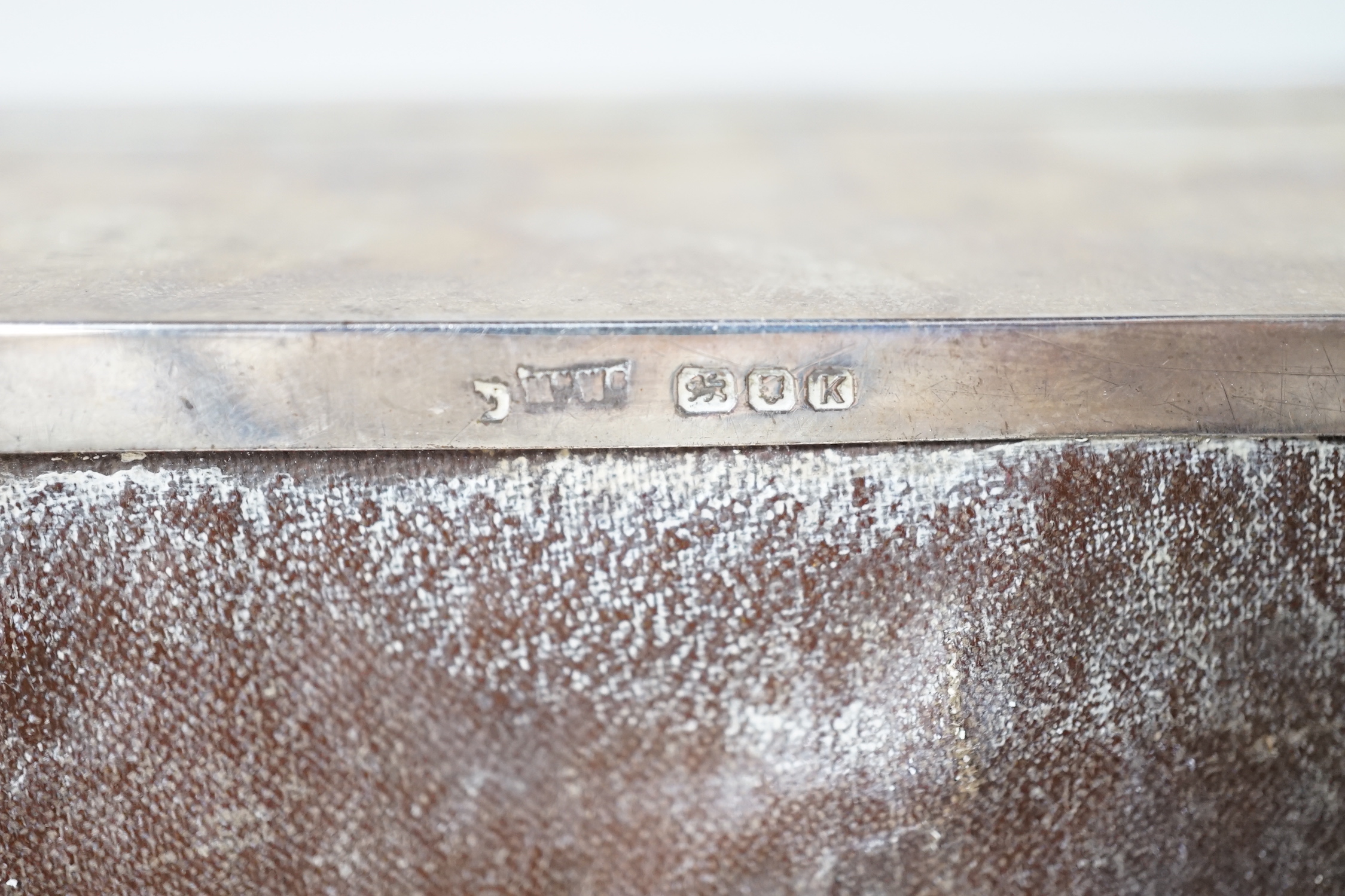 A George VI plain rectangular silver cigarette box with initials MJL, Mappin & Webb, London 1945, 14cm, gross 479 grams